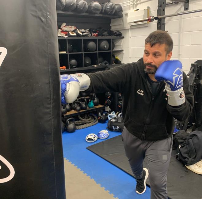 Alex  working on the heavy bag